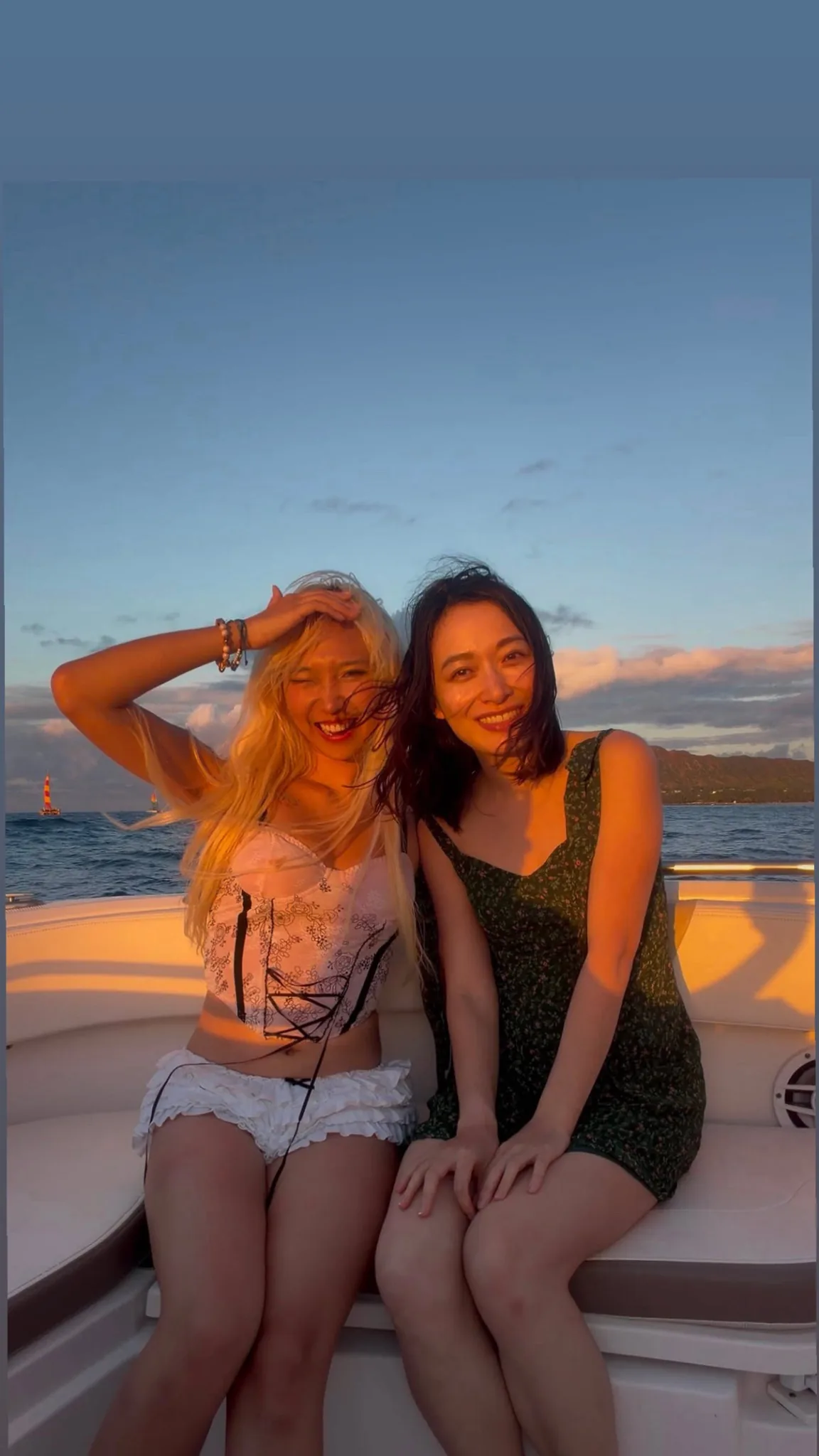 Friends enjoying a private charter at sunset